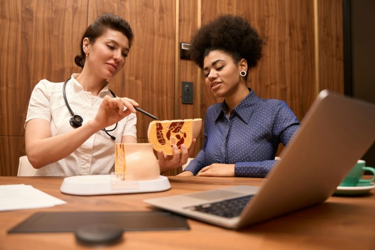African American lady looking at pelvic floor sample