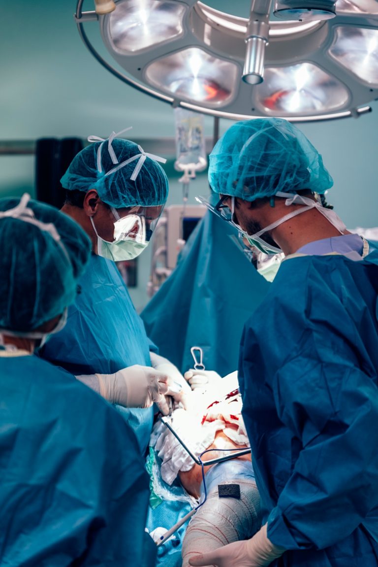 Team of Surgeons Operating.